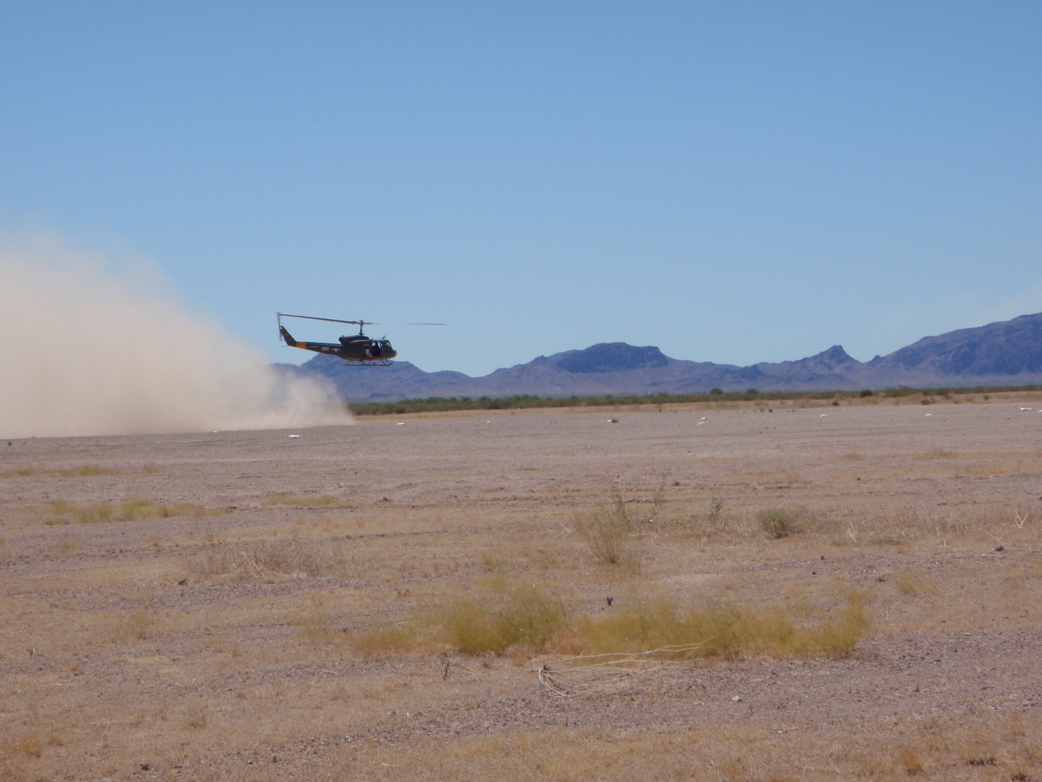 A helicopter lands on the dusty plains at Yuma Proving Grounds, AZ in an effort to better understand Helicopter Brownout