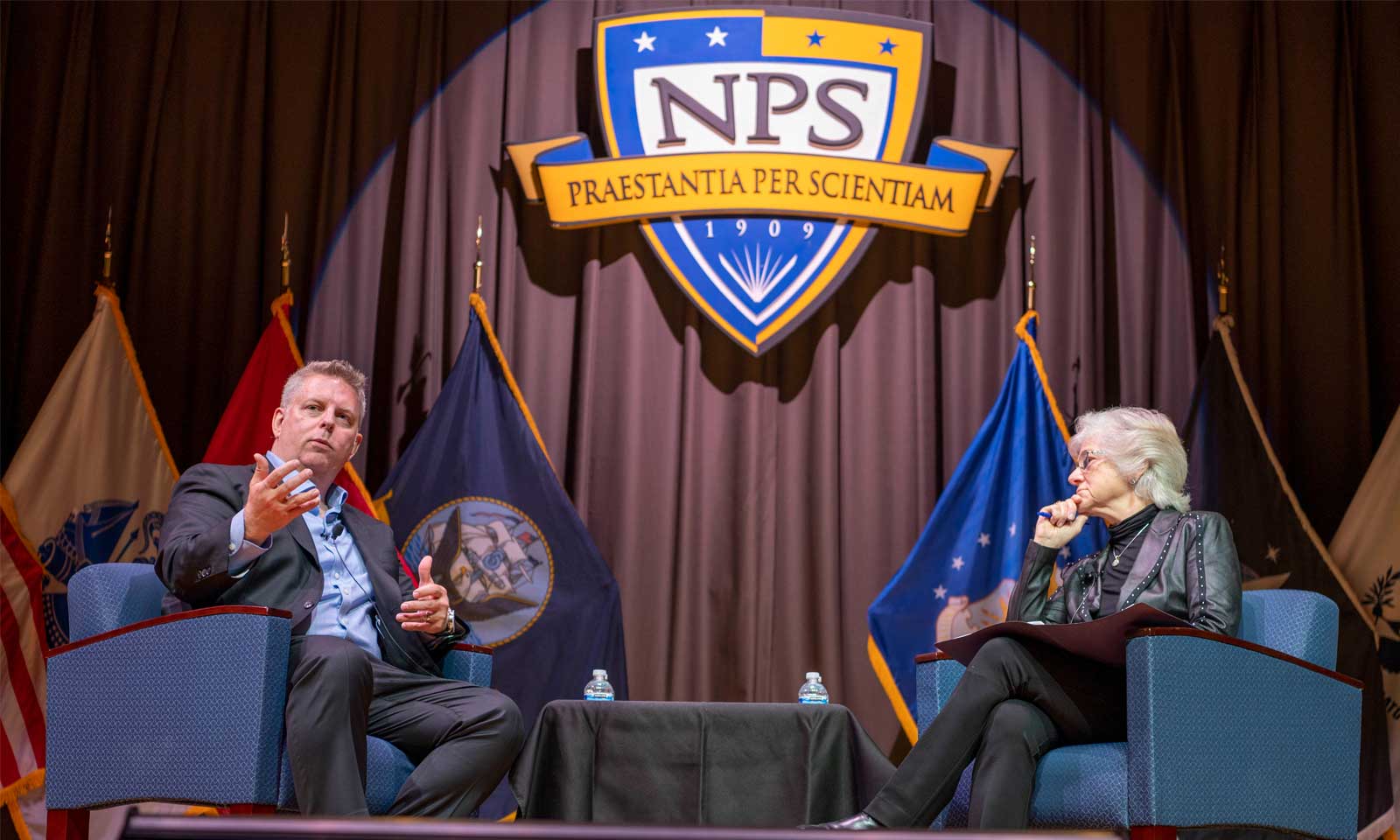 Jason Zander, executive vice president at Microsoft, left, discusses cyberspace and the importance of public-private partnerships with Naval Postgraduate School President retired Vice Adm. Ann Rondeau during the latest Secretary of the Navy Guest Lecture (SGL), June 6. (U.S. Navy photo by MC2 Lenny Weston)