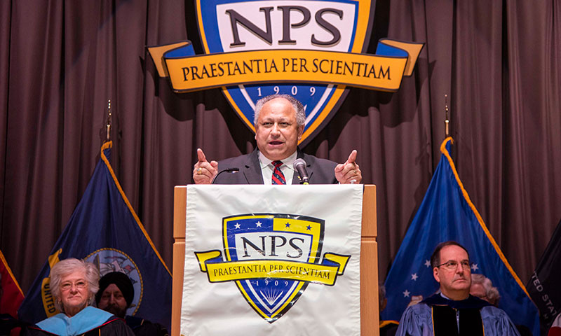 Secretary of the Navy Carlos Del Toro gives the commencement address during Fall Quarter graduation.